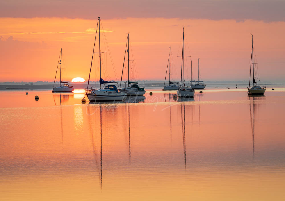 Summer sunrise with boats on the River Blackwater, Steeple